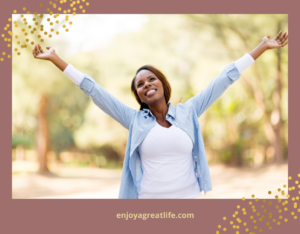 woman with arms in air happy to be alive