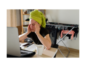 working from home towel on head drying clothes in background