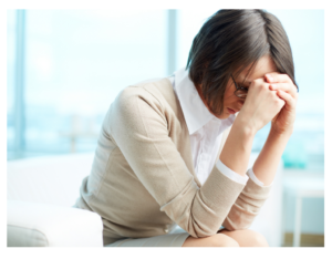 woman head in hands depressed