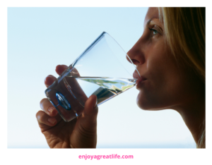 woman drinking glass of water