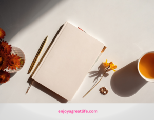 journal pen and cup of tea on a kitchen table